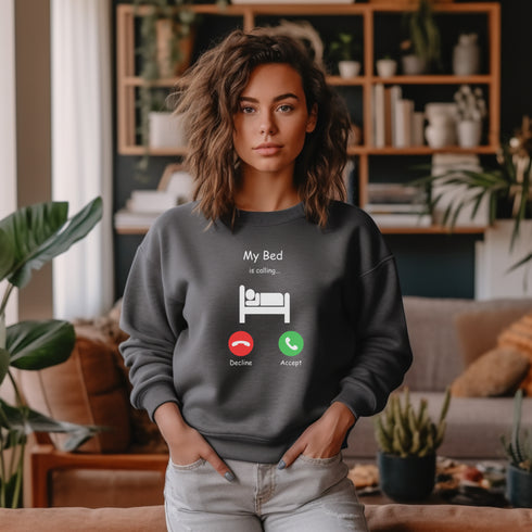 Introducing the ultimate sweatshirt for all those who love their bed more than anything else - the My Bed Is Calling Sweatshirt! Featuring a hilarious stick figure lying in bed, this sweatshirt is the perfect way to show off your love for all things cozy and comfortable.